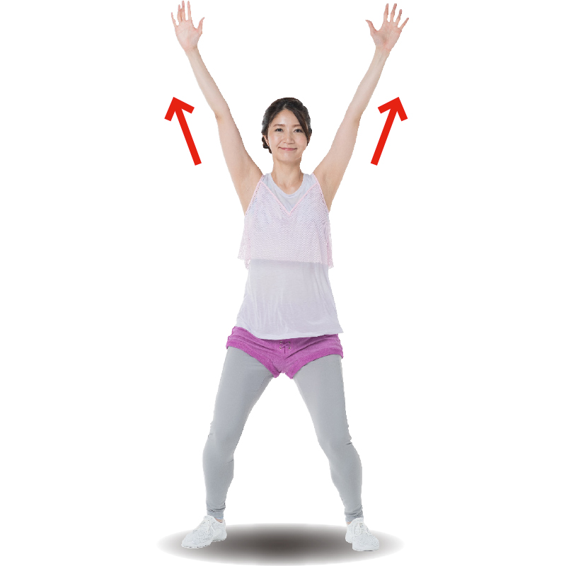 膝を曲げた状態で両手を上に上げるトレーニング着の女性