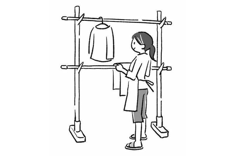 洗濯物を干す女性のイラスト